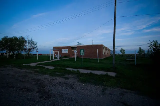 Old brick school building at dusk